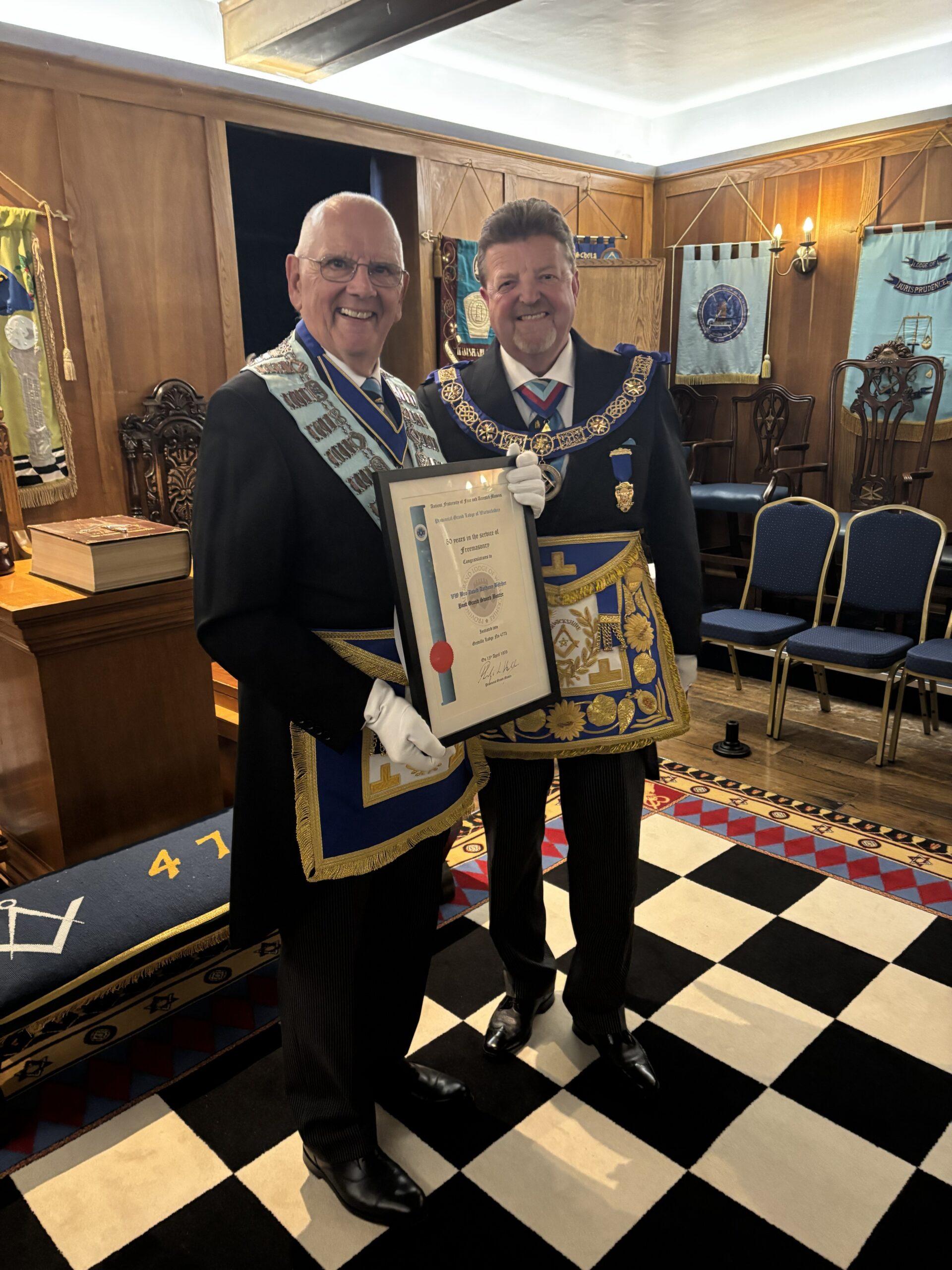 Our very own Very Worshipful Brother David Butcher receiving his 50-year certificate from the Provincial Grand Master.