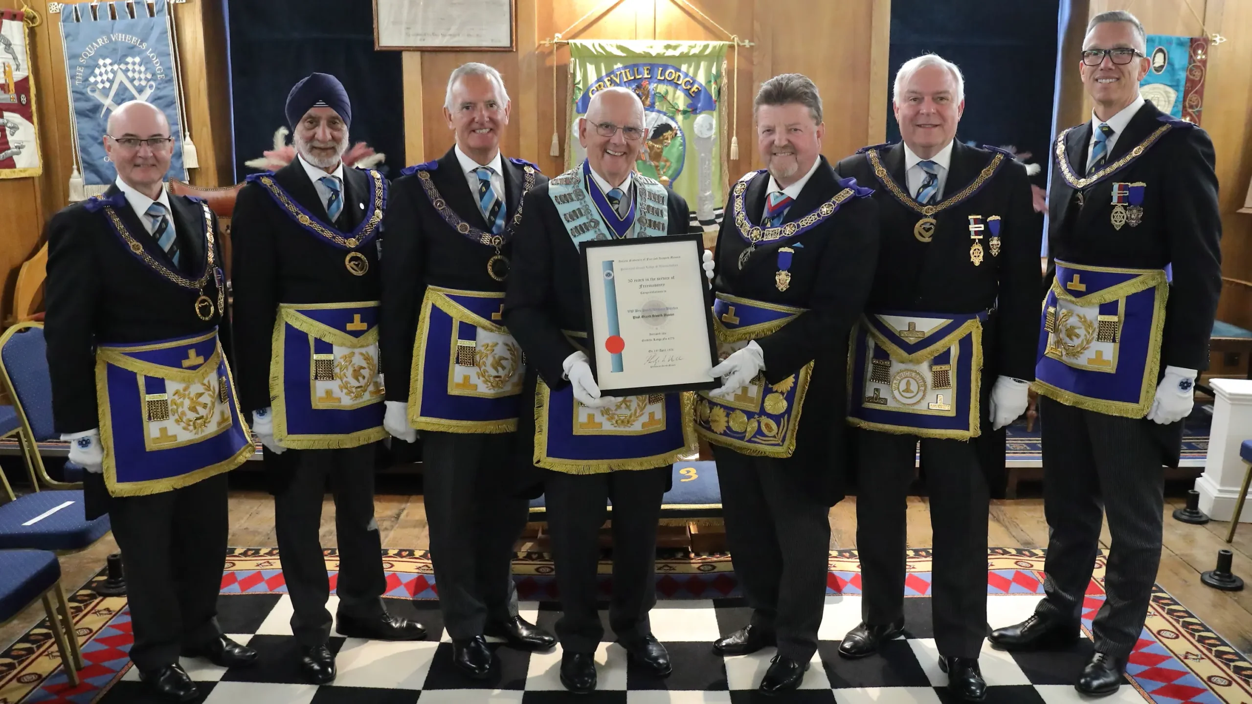 Our very own Very Worshipful Brother David Butcher receiving his 50-year certificate from the Provincial Grand Master.